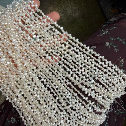 Long Necklace Featuring Natural White Freshwater Baroque Style Pearls With 3-4mm Baroque Pearl Diameter
