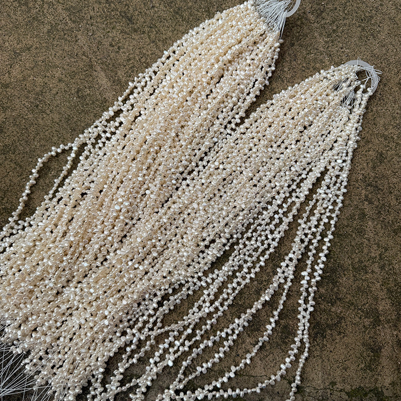 Long Necklace Featuring Natural White Freshwater Baroque Style Pearls With 3-4mm Baroque Pearl Diameter