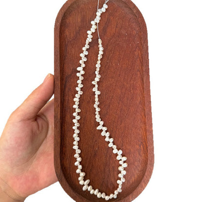 Long Necklace Featuring Natural White Freshwater Baroque Style Pearls With 3-4mm Baroque Pearl Diameter