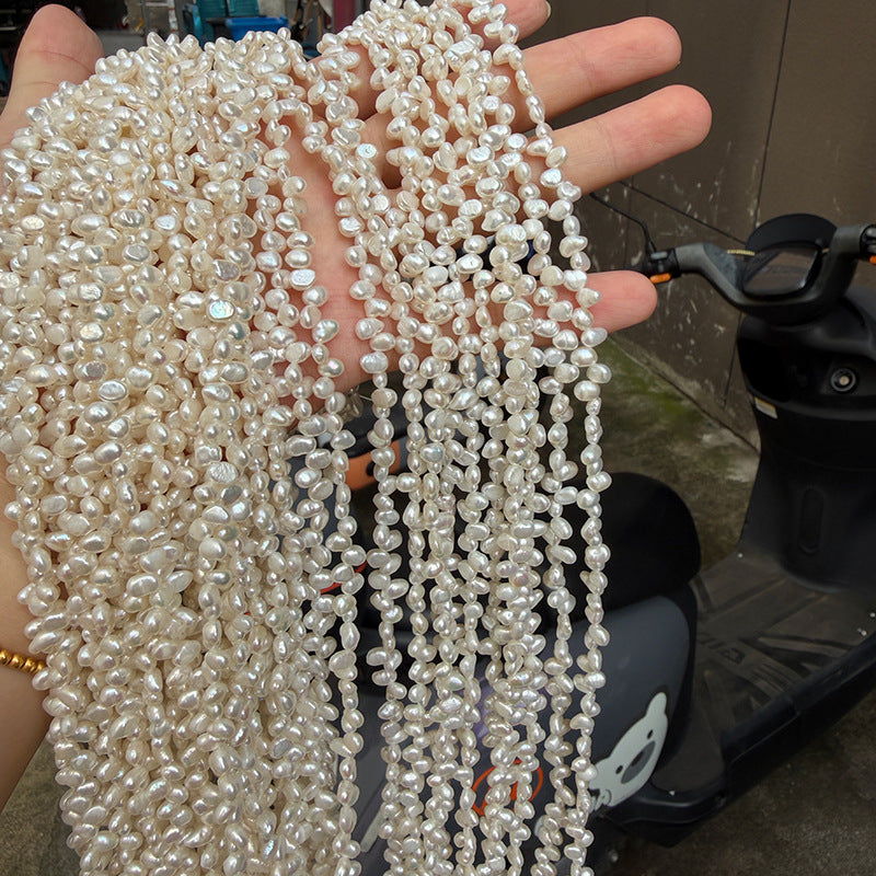 Long Necklace Featuring Natural White Freshwater Baroque Style Pearls With 3-4mm Baroque Pearl Diameter