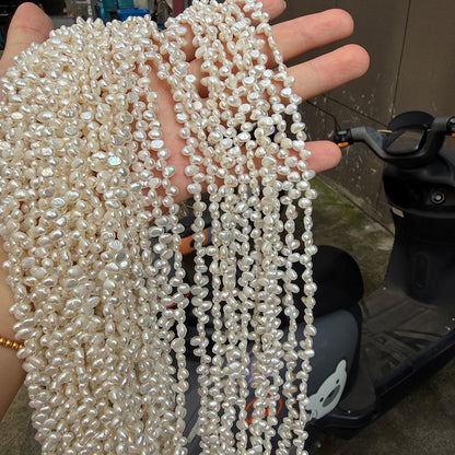 Long Necklace Featuring Natural White Freshwater Baroque Style Pearls With 3-4mm Baroque Pearl Diameter