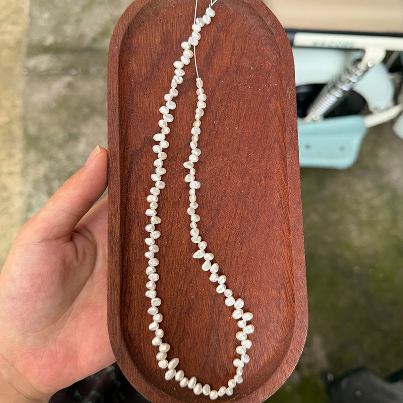 Long Necklace Featuring Natural White Freshwater Baroque Style Pearls With 3-4mm Baroque Pearl Diameter