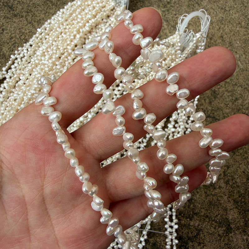Long Necklace Featuring Natural White Freshwater Baroque Style Pearls With 3-4mm Baroque Pearl Diameter