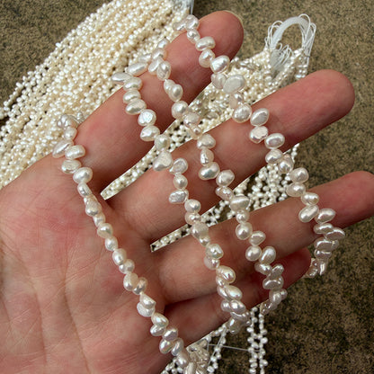 Long Necklace Featuring Natural White Freshwater Baroque Style Pearls With 3-4mm Baroque Pearl Diameter