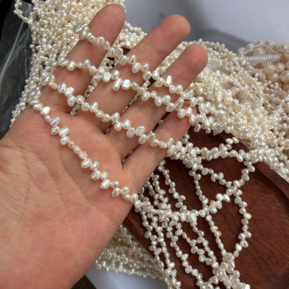 Long Necklace Featuring Natural White Freshwater Baroque Style Pearls With 3-4mm Baroque Pearl Diameter