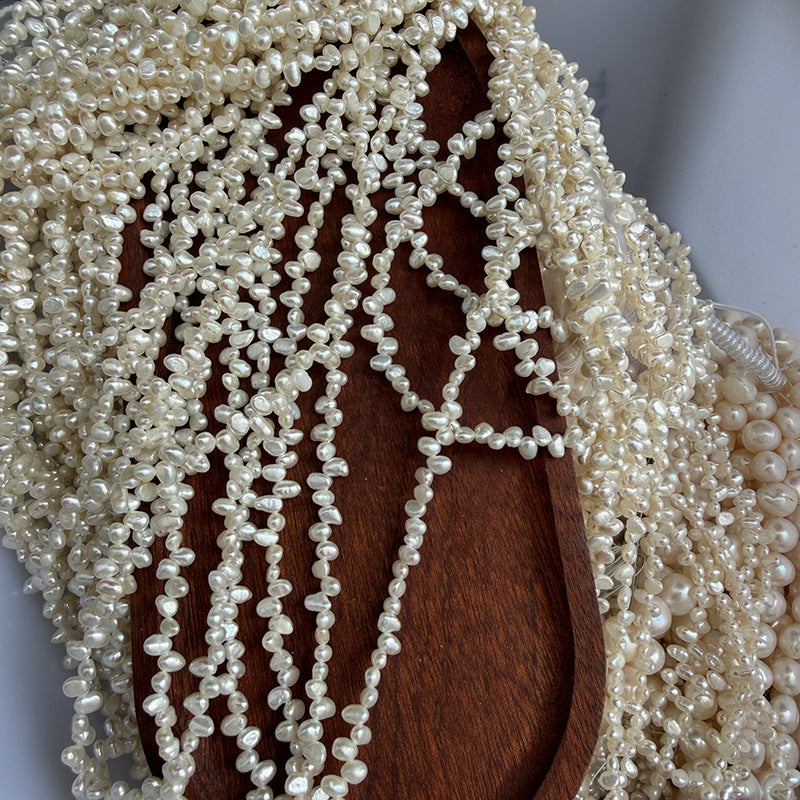 Long Necklace Featuring Natural White Freshwater Baroque Style Pearls With 3-4mm Baroque Pearl Diameter