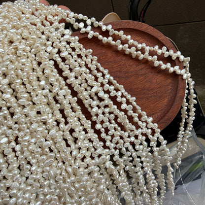 Long Necklace Featuring Natural White Freshwater Baroque Style Pearls With 3-4mm Baroque Pearl Diameter