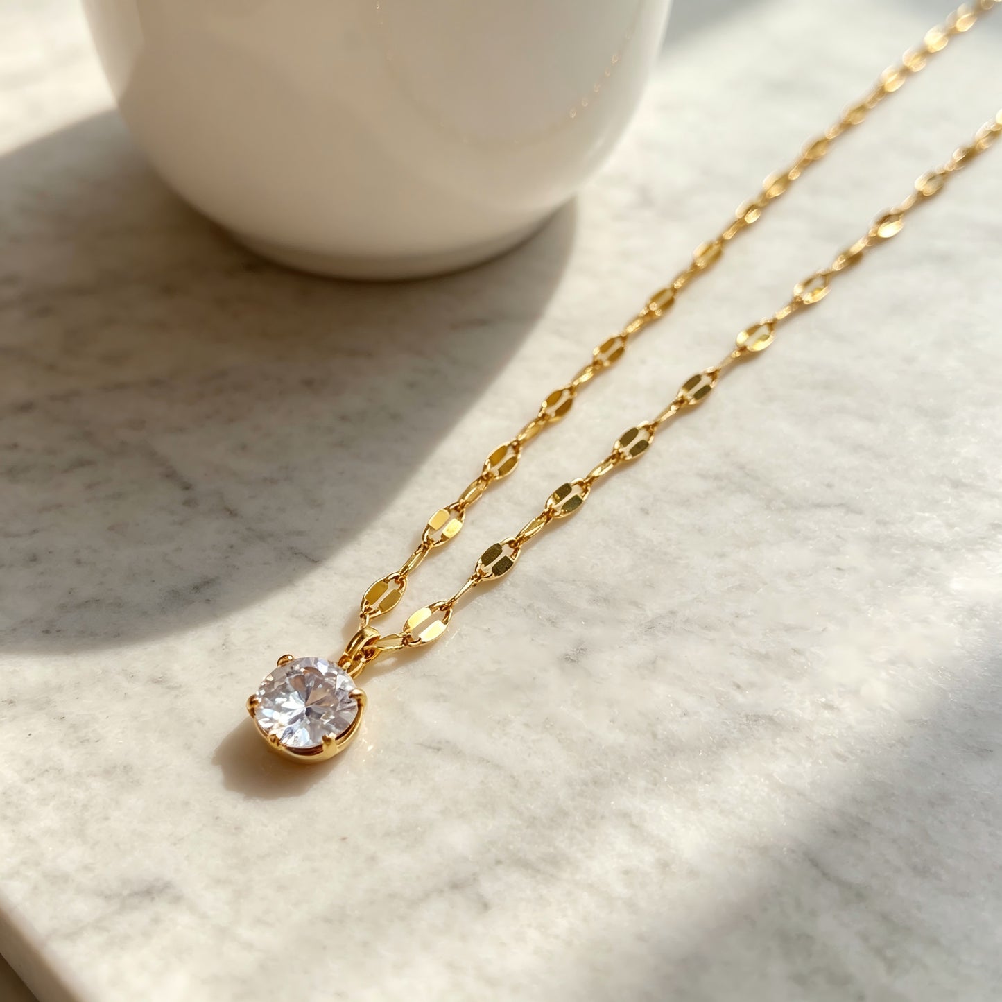 Geometric Gold Pendant Necklace In Titanium Steel With Zircon Inlay And Claw Setting, Featuring Coffee Bean Chain