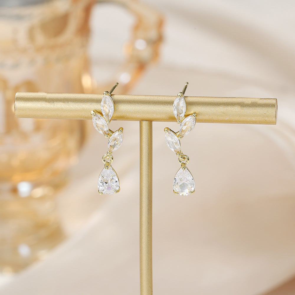 Gold Water Droplets Earrings For Women Featuring Copper Studs And Zircon Inlay Material