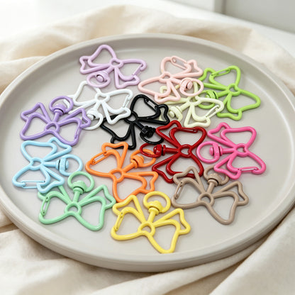 Alloy Keychain Accessory With Bow Tie Pattern Featuring Stoving Varnish And Spring Ring Trigger Clasp Closure In Simple Style