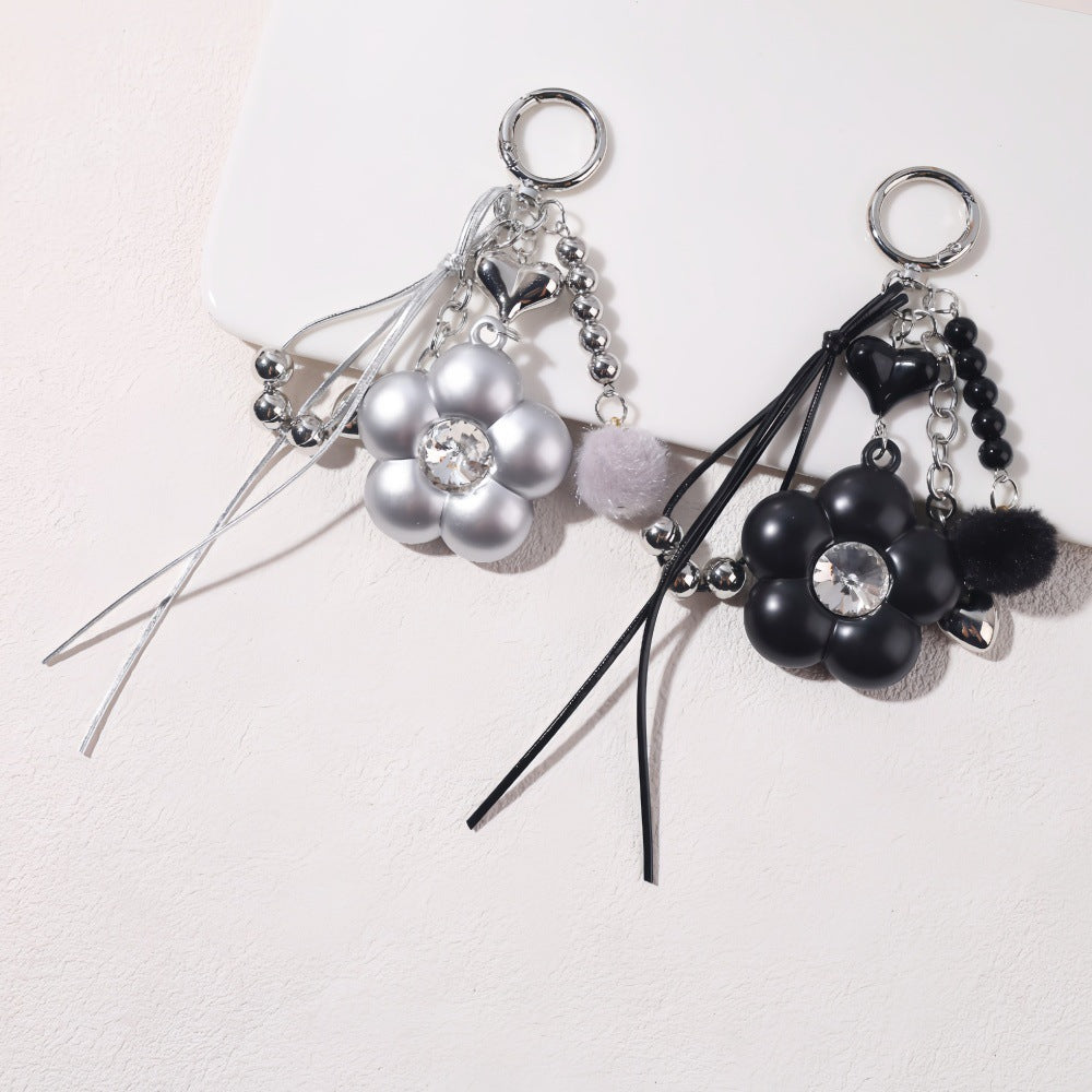 Dyed Black Flowers Bag Pendant With Diamond Inlay In Metal, Stylish Key Chain Accessory