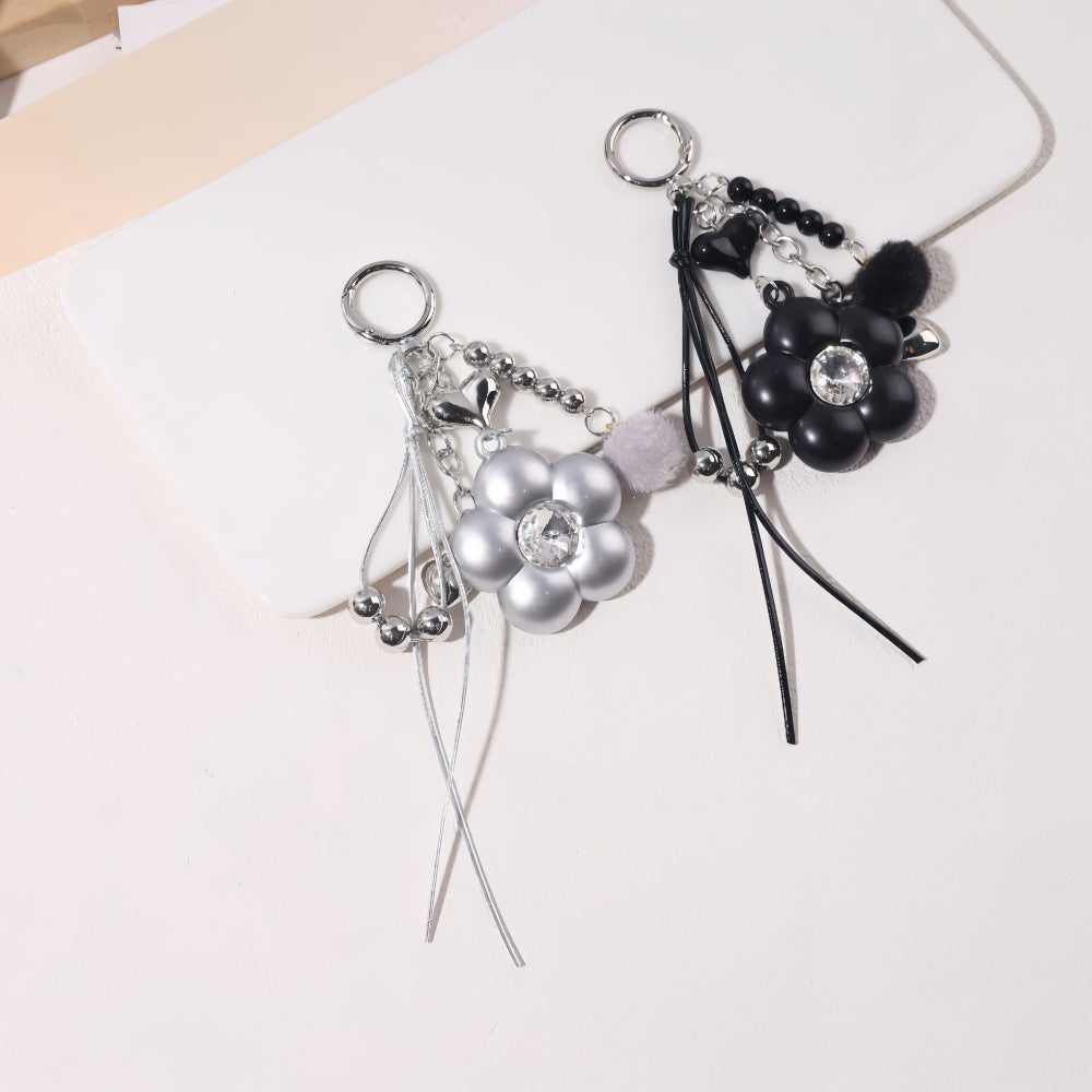 Dyed Black Flowers Bag Pendant With Diamond Inlay In Metal, Stylish Key Chain Accessory