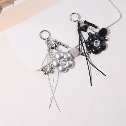 Dyed Black Flowers Bag Pendant With Diamond Inlay In Metal, Stylish Key Chain Accessory