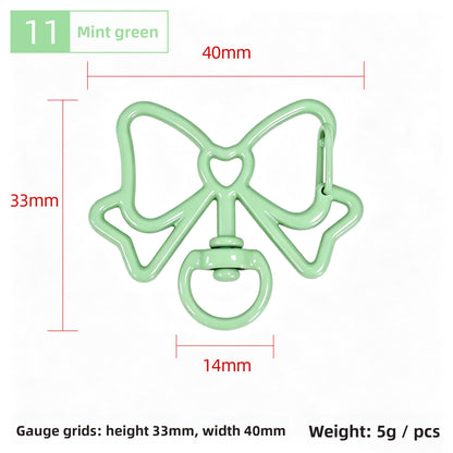 Alloy Keychain Accessory With Bow Tie Pattern Featuring Stoving Varnish And Spring Ring Trigger Clasp Closure In Simple Style