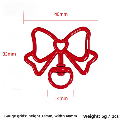 Alloy Keychain Accessory With Bow Tie Pattern Featuring Stoving Varnish And Spring Ring Trigger Clasp Closure In Simple Style