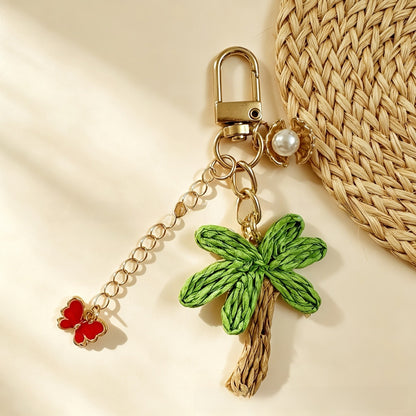 Starfish Knitting Key Chain In Green With Straw Material, Featuring A Vacation Style Design