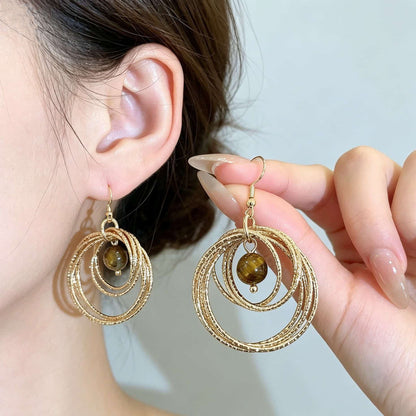 IG Style Round Twist Earrings For Women In KC Golden Plated Metal With 0.03µm Coating Thickness