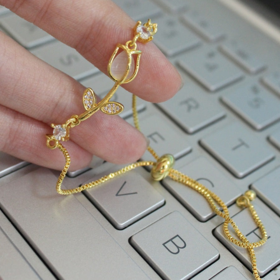 Sweet Tulips Bracelet For Women In Golden Plated Copper With Cat's Eye Stone Featuring Electroplated Finish