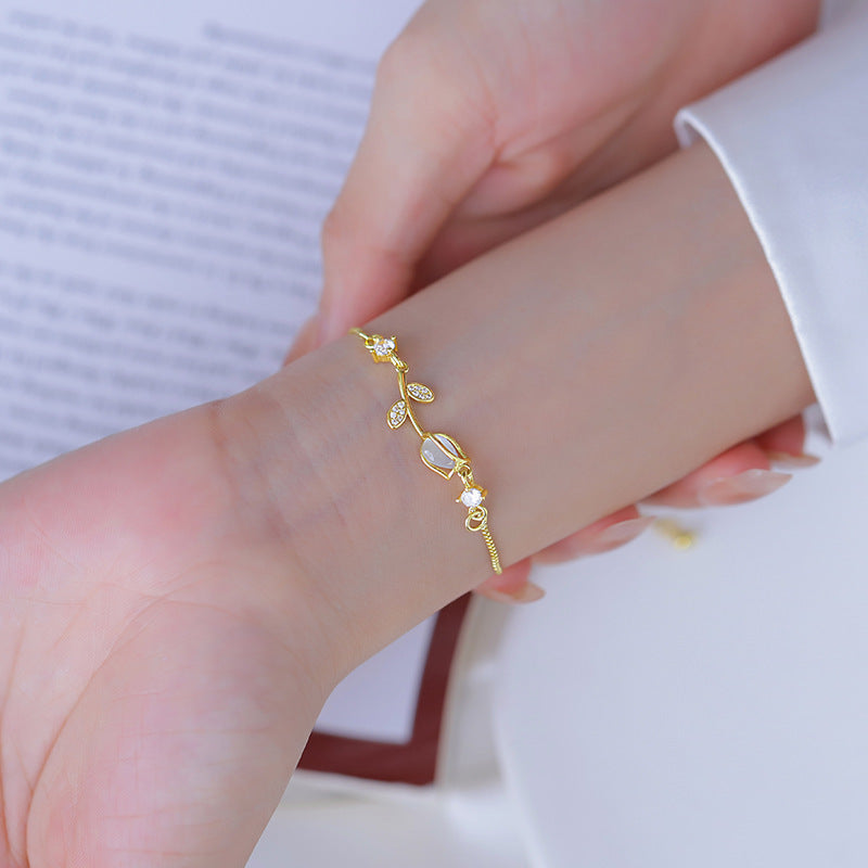 Sweet Tulips Bracelet For Women In Golden Plated Copper With Cat's Eye Stone Featuring Electroplated Finish