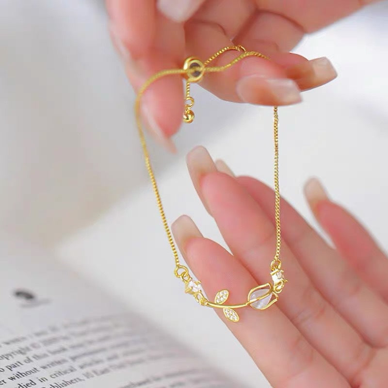 Sweet Tulips Bracelet For Women In Golden Plated Copper With Cat's Eye Stone Featuring Electroplated Finish