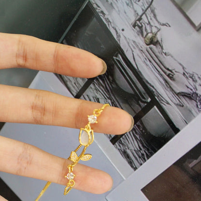 Sweet Tulips Bracelet For Women In Golden Plated Copper With Cat's Eye Stone Featuring Electroplated Finish