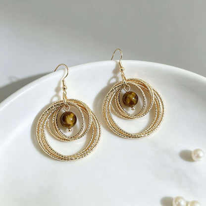 IG Style Round Twist Earrings For Women In KC Golden Plated Metal With 0.03µm Coating Thickness