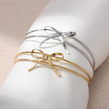 Sweet Style Bow Tie Bangle In Titanium Steel With 18K Real Gold Plated PVD Coating, Available In Gold