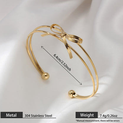 Sweet Style Bow Tie Bangle In Titanium Steel With 18K Real Gold Plated PVD Coating, Available In Gold