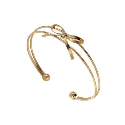 Sweet Style Bow Tie Bangle In Titanium Steel With 18K Real Gold Plated PVD Coating, Available In Gold