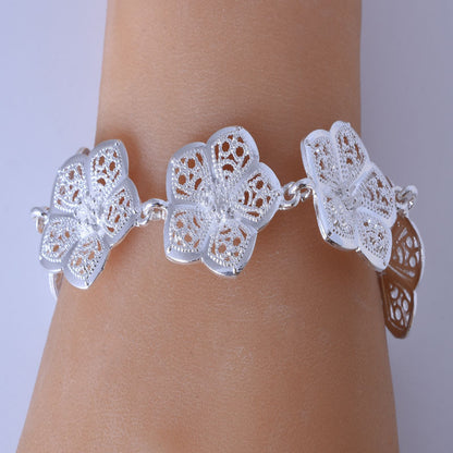 Exaggerated Flowers Gold Alloy Bracelet For Women With Electroplated Finish, Stylish Bangle Accessory
