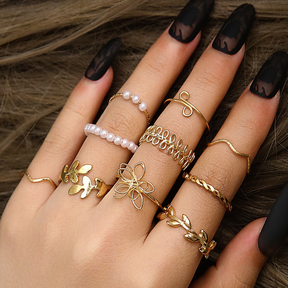 Set Of 10 Electroplated Gold Flowers Rings For Women With Imitation Pearl Inlay Made Of Zinc Alloy