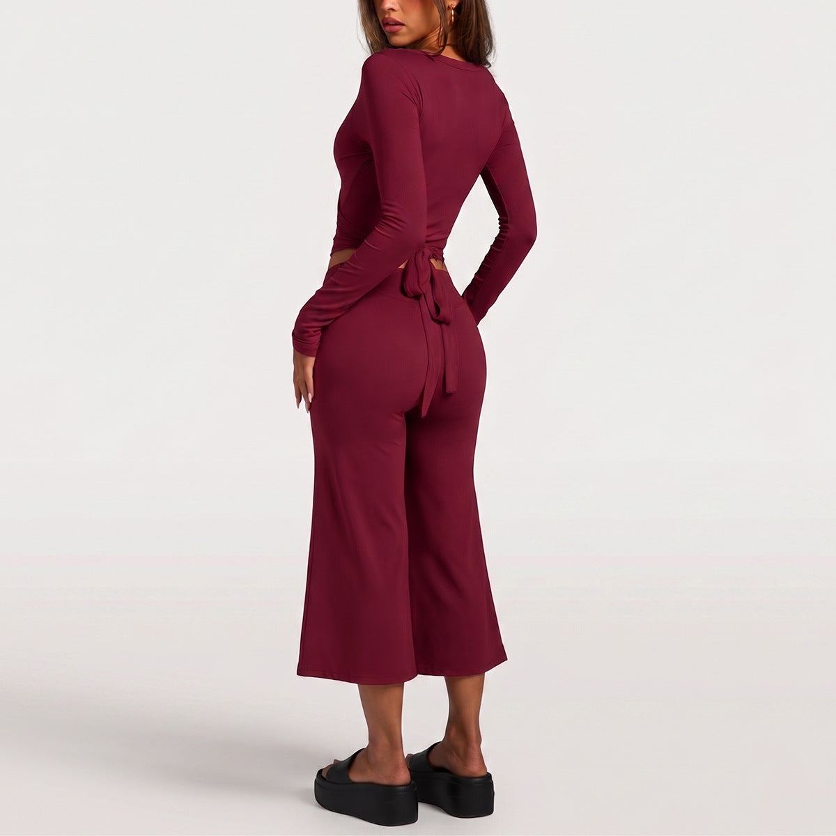 Full Length Sport Yoga Jumpsuit For Women In Stretchy Nylon Fabric Featuring Criss Cross Design With Long Sleeves