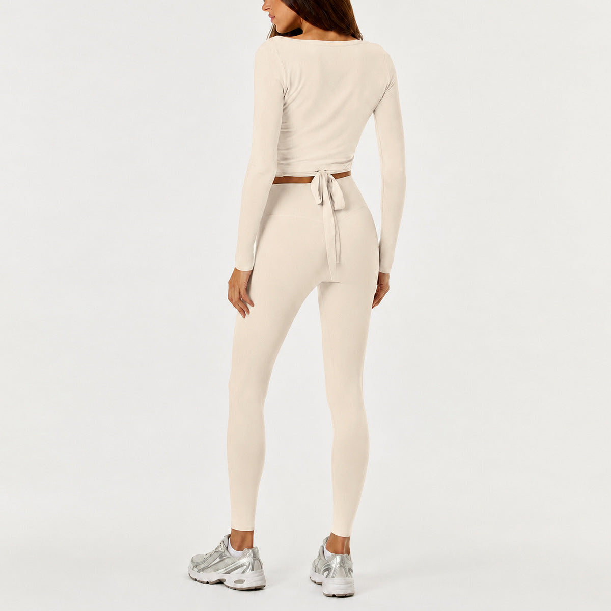 Full Length Sport Yoga Jumpsuit For Women In Stretchy Nylon Fabric Featuring Criss Cross Design With Long Sleeves