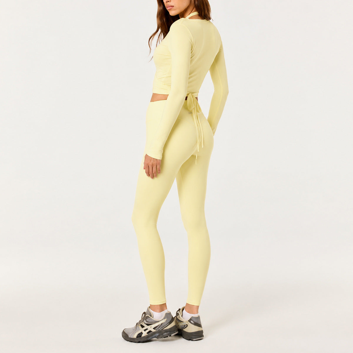 Full Length Sport Yoga Jumpsuit For Women In Stretchy Nylon Fabric Featuring Criss Cross Design With Long Sleeves
