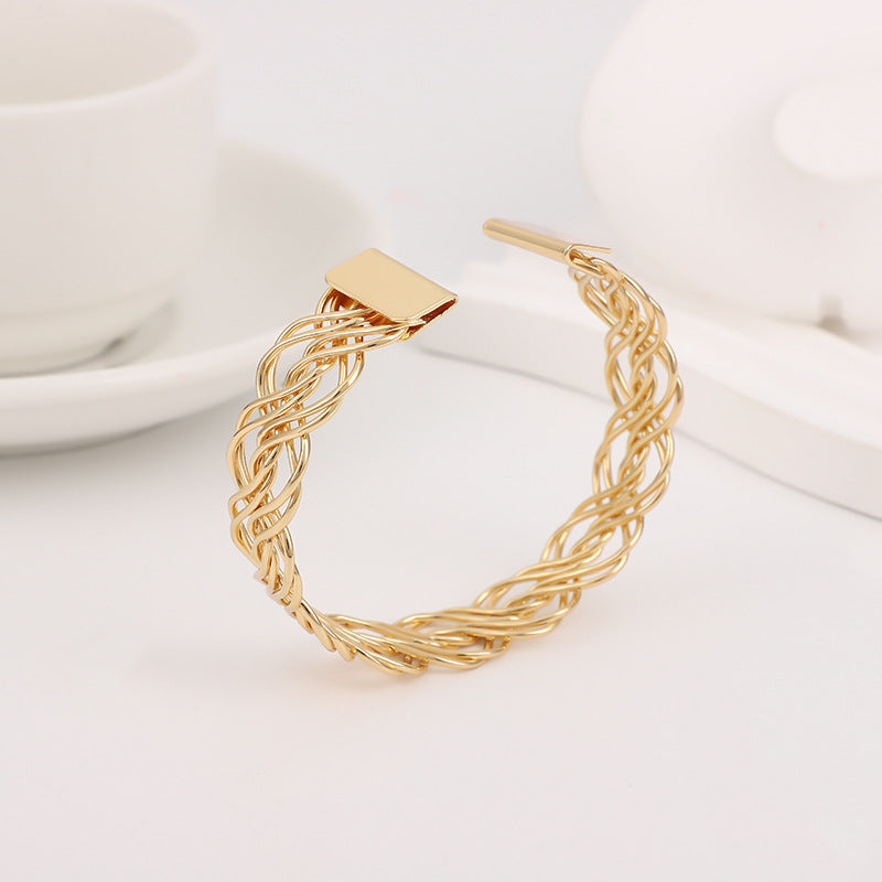 Bohemian Gold Braid Bangle In Metal Featuring Electroplated Golden Plated Finish