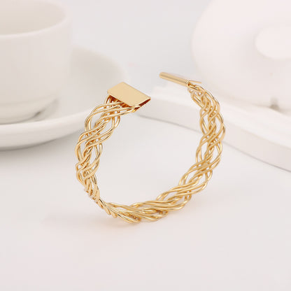 Bohemian Gold Braid Bangle In Metal Featuring Electroplated Golden Plated Finish