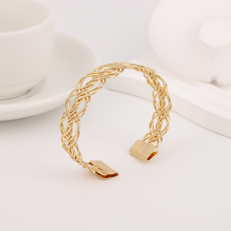 Bohemian Gold Braid Bangle In Metal Featuring Electroplated Golden Plated Finish