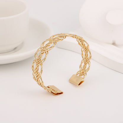 Bohemian Gold Braid Bangle In Metal Featuring Electroplated Golden Plated Finish