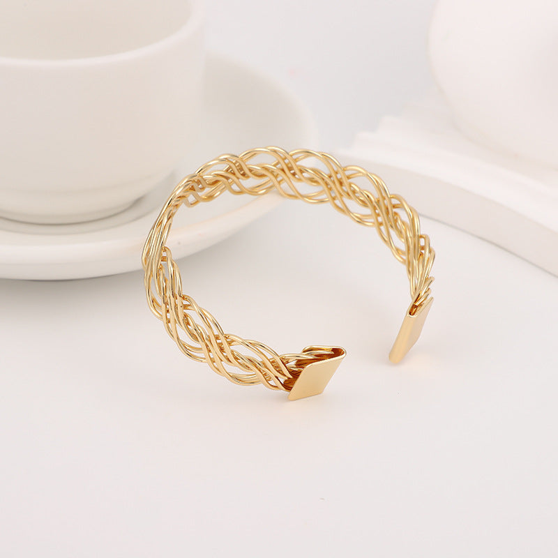 Bohemian Gold Braid Bangle In Metal Featuring Electroplated Golden Plated Finish