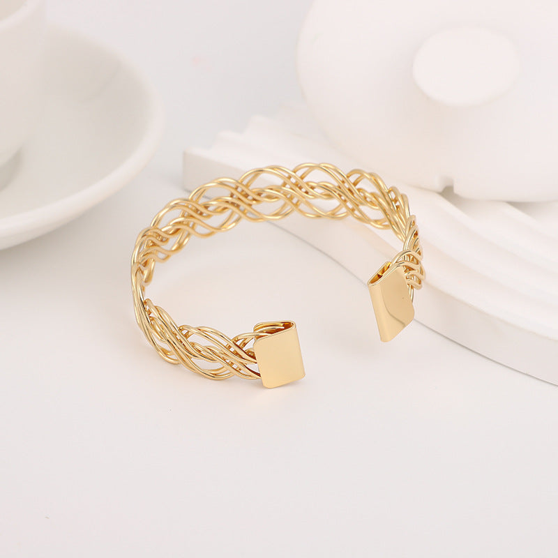 Bohemian Gold Braid Bangle In Metal Featuring Electroplated Golden Plated Finish