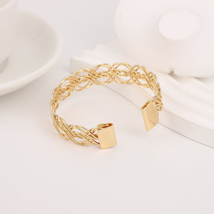 Bohemian Gold Braid Bangle In Metal Featuring Electroplated Golden Plated Finish