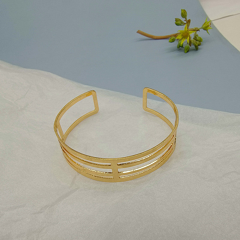 Geometric Punk Gold Bangle Featuring Electroplated Metal Craftsmanship