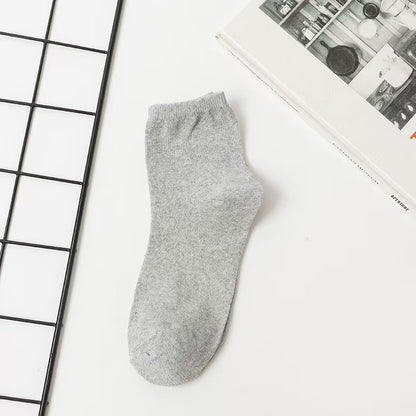 Unisex Casual Solid Color Socks In Dyed Black, Made With Comfortable Polyester Cotton For Spring Wear