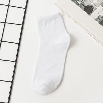 Unisex Casual Solid Color Socks In Dyed Black, Made With Comfortable Polyester Cotton For Spring Wear