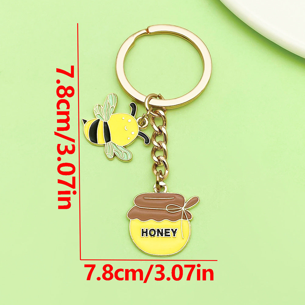 Bee Honeycomb Pendant Featuring A Detailed Bee Pattern In Durable Alloy, Available In Yellow