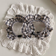 A Pair of Black and White Checkered Hair Ties