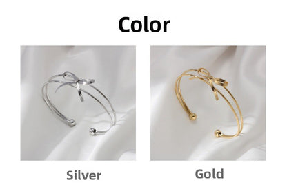 Sweet Style Bow Tie Bangle In Titanium Steel With 18K Real Gold Plated PVD Coating, Available In Gold