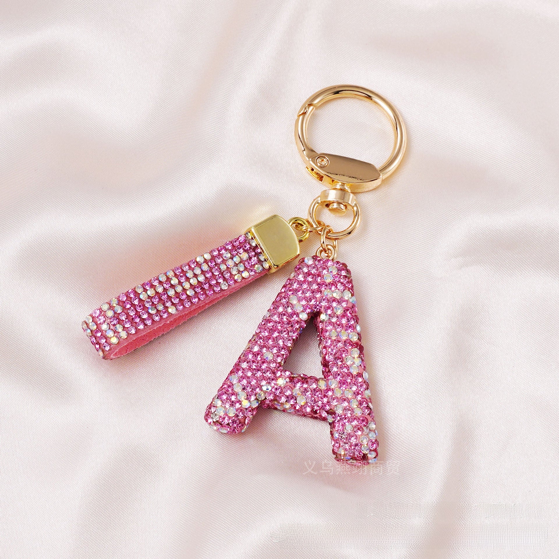 New Year Letter Bag Charm Key Chain In Natural Pink Featuring Pottery Clay And Rhinestone Inlay