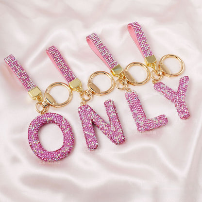New Year Letter Bag Charm Key Chain In Natural Pink Featuring Pottery Clay And Rhinestone Inlay