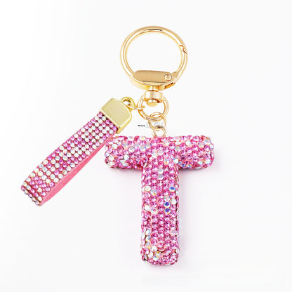 New Year Letter Bag Charm Key Chain In Natural Pink Featuring Pottery Clay And Rhinestone Inlay